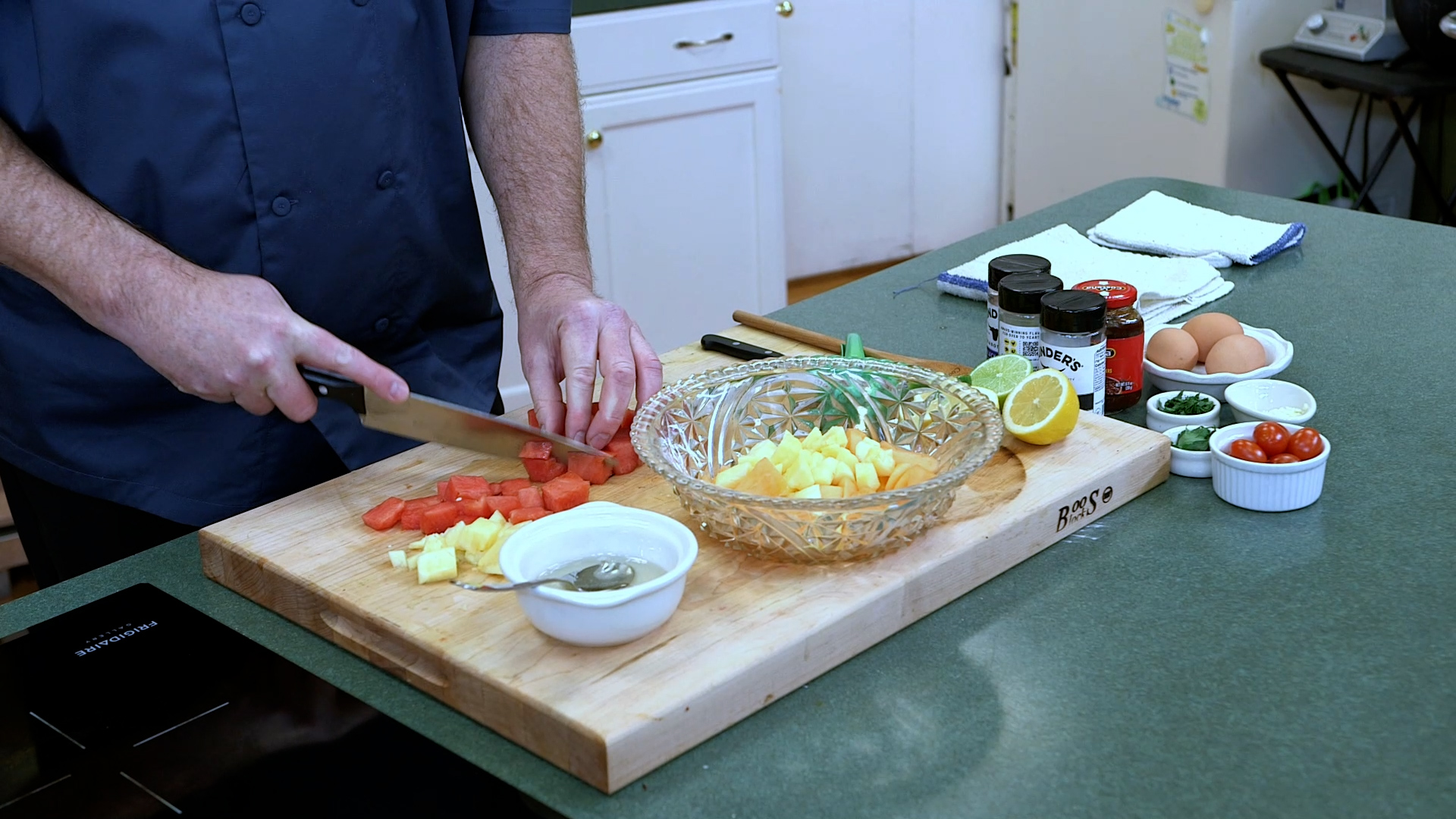 watermelon, cantaloupe, and pineapple cutting