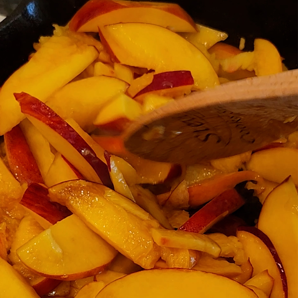 stir peaches to coat with butter