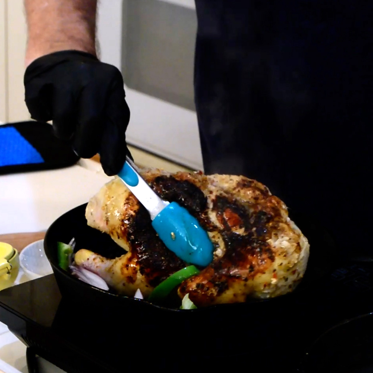 brick chicken flip chicken with tongs